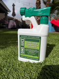 Spray bottle labeled 'Dino Juice turf odor eliminator and cleaner' on artificial grass